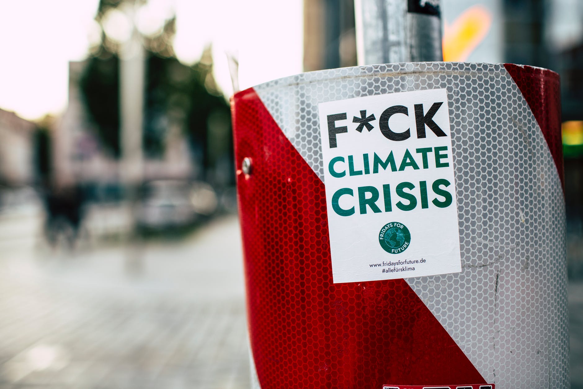 sticker of climate crisis attached in metal